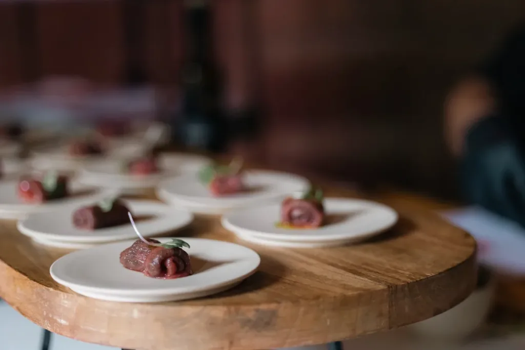 beef-canapes-on-wooden-serving-board svg+xml;charset=utf